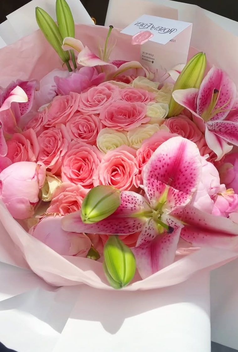White lily and cream rose sympathy arrangement